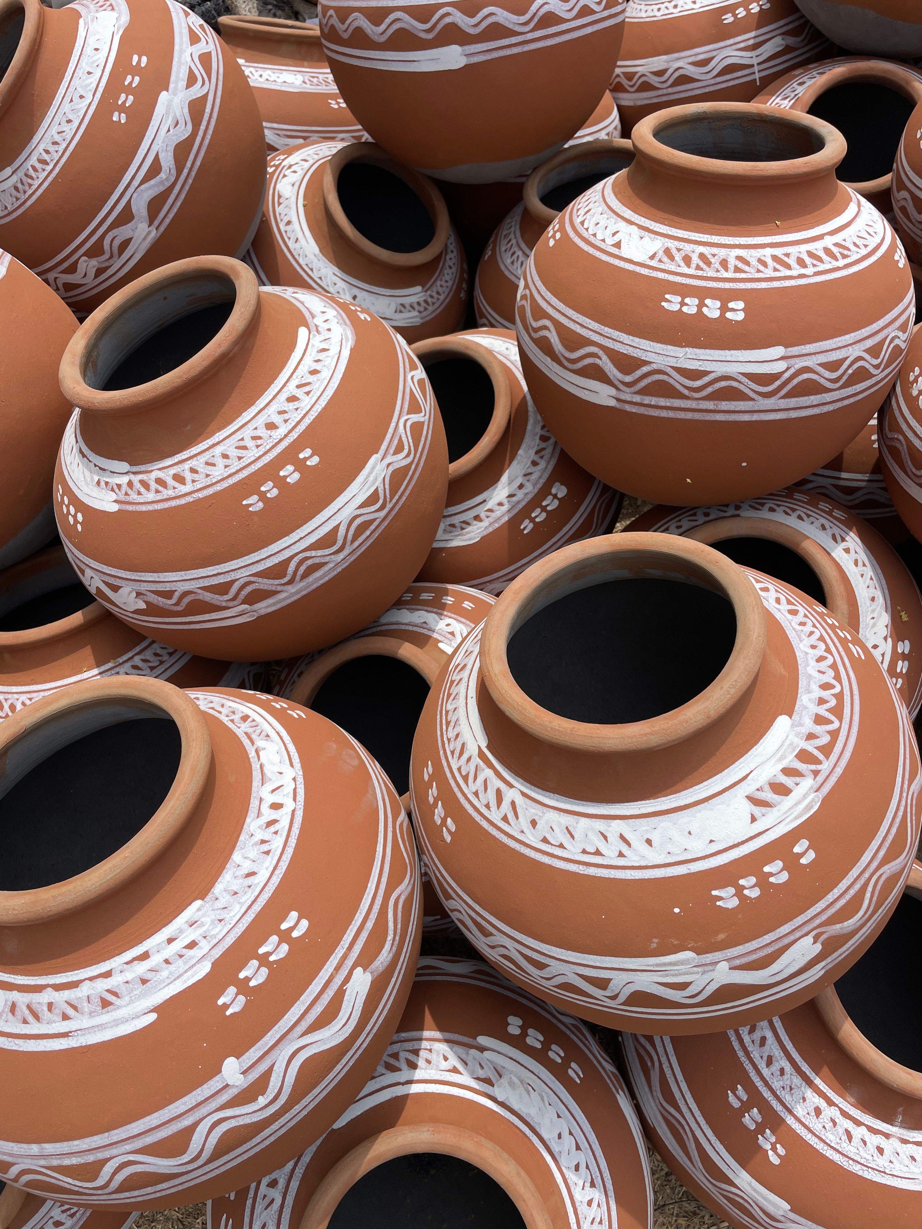 A clay pot (kaccha ghada) on the banks of the Chenab river at sunset