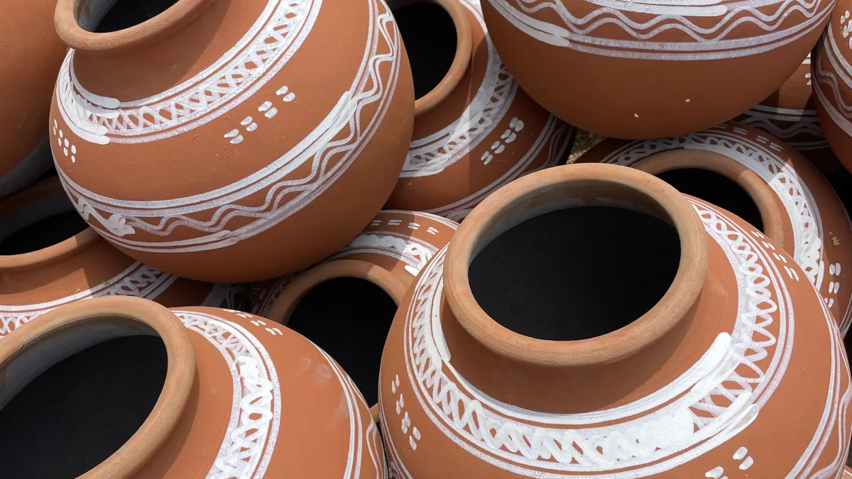 A clay pot (kaccha ghada) on the banks of the Chenab river at sunset