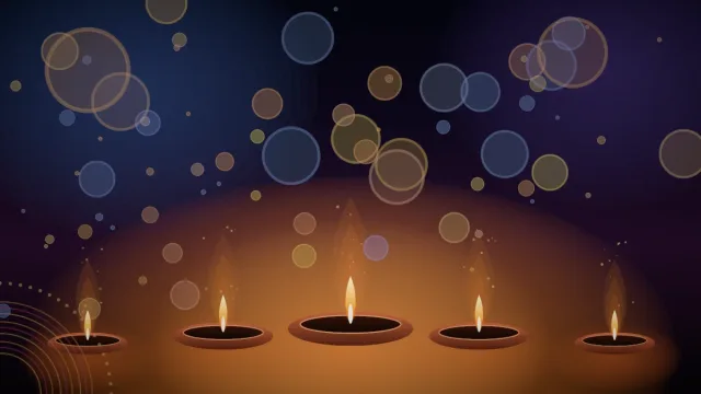 Rows of lit clay diyas glowing during Diwali, the festival of lights